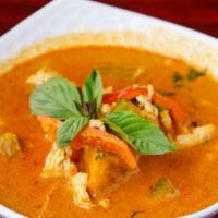 38. Pumpkin Curry · Hot. Choice of chicken, beef or pork in medium red curry with pumpkin, red bell peppers, and...