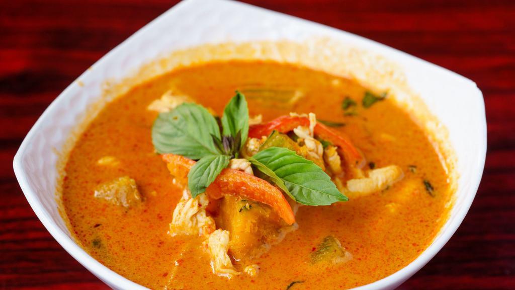 38. Pumpkin Curry · Hot. Choice of chicken, beef or pork in medium red curry with pumpkin, red bell peppers, and fresh basil.