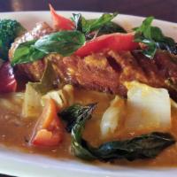 Choo Chee Pla · Fried Atlantic salmon fillet sauce with red curry sauce, peanut sauce, cabbage, broccoli, re...