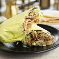 Chicken Shawarma Wrap · Marinated chicken, pickles, lettuce, garlic white sauce and french fries inside a lavash bread