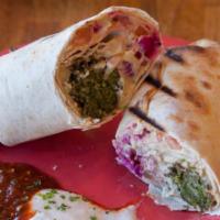 Falafel Wrap · Home Made From Scratch ,  ground chickpeas, parsley, and our special mix of spices. Served w...