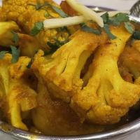 Aloo Gobi · Vegan, gluten free. Cauliflower and potatoes cooked with spices.