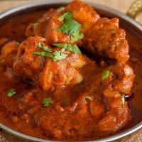 Chicken Vindaloo · Boneless chicken and potatoes cooked with spices in thick curry sauce.