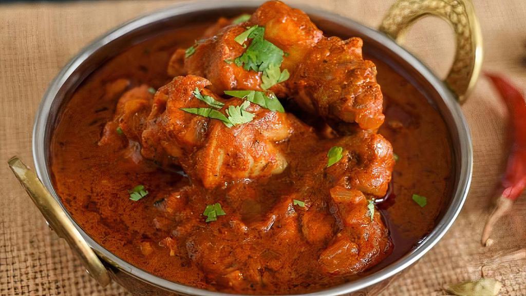 Chicken Vindaloo · Boneless chicken and potatoes cooked with spices in thick curry sauce.