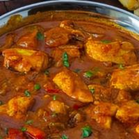 Chicken Curry-Boneless · Boneless chicken cooked in onion and tomato base gravy sauce with Indian spices.