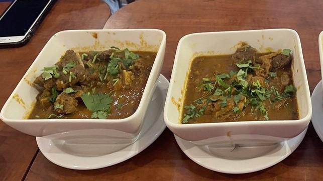 Lamb Curry · Boneless lamb cooked with homemade spices on tomato and onion gravy sauce.