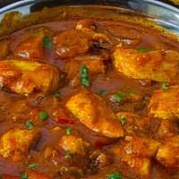 Fish Curry · Salmon cooked with Indian spices in onion tomato base sauce.