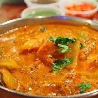 Fish Tikka Masala · Salmon cooked with thick creamy onion and tomato sauce with Indian spices.