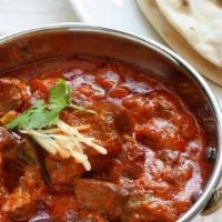 Fish Vindaloo · Salmon and potatoes cooked with Indian spices on thick curry sauce.