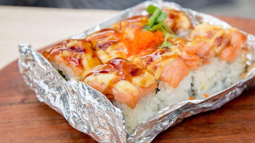 Lion King · Baked California roll topped with salmon, spicy mayo and tobiko.