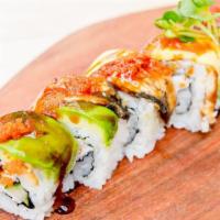 Dragon Roll · Imitation crab, avocado, sesame seeds, topped with avocado, unagi, and tobiko.