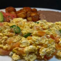 *Huevos a la Mexicana Plate · 3 scrambled eggs, cooked with fresh onions, tomatoes and serrano peppers, served with refrie...
