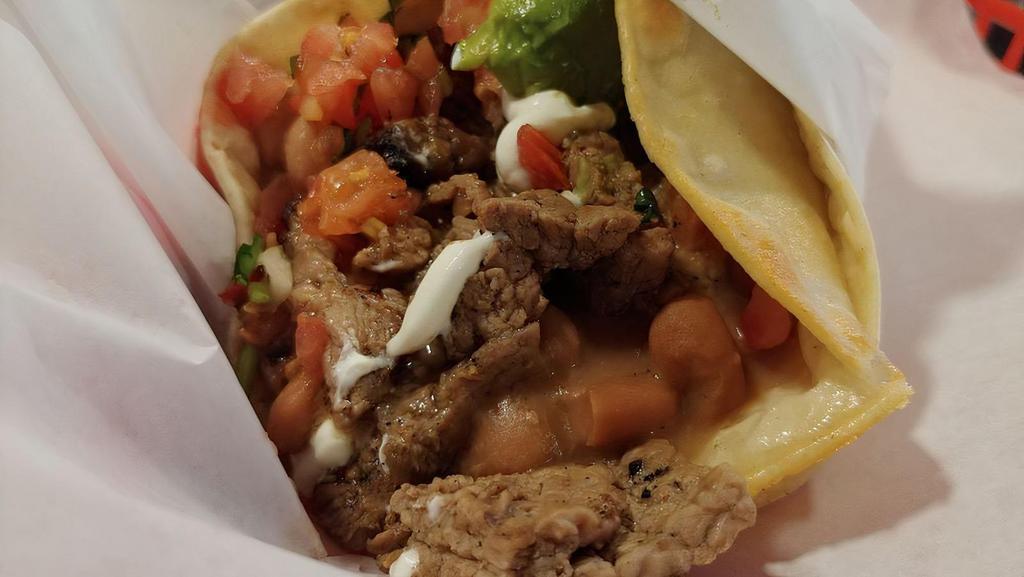 Super Taco · Meat of your choice in 2 corn tortillas, beans, salsa fresca, cheese, avocado and sour cream
