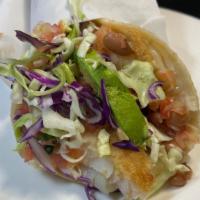 Super Fish Taco · Grilled filet of fish in 2 corn tortillas with salsa fresca, cabbage, cheese, and avocado