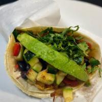 Taco Mex · 2 corn tortillas with grilled zucchini,  with black beans, avocado, cilantro, and molcajete.