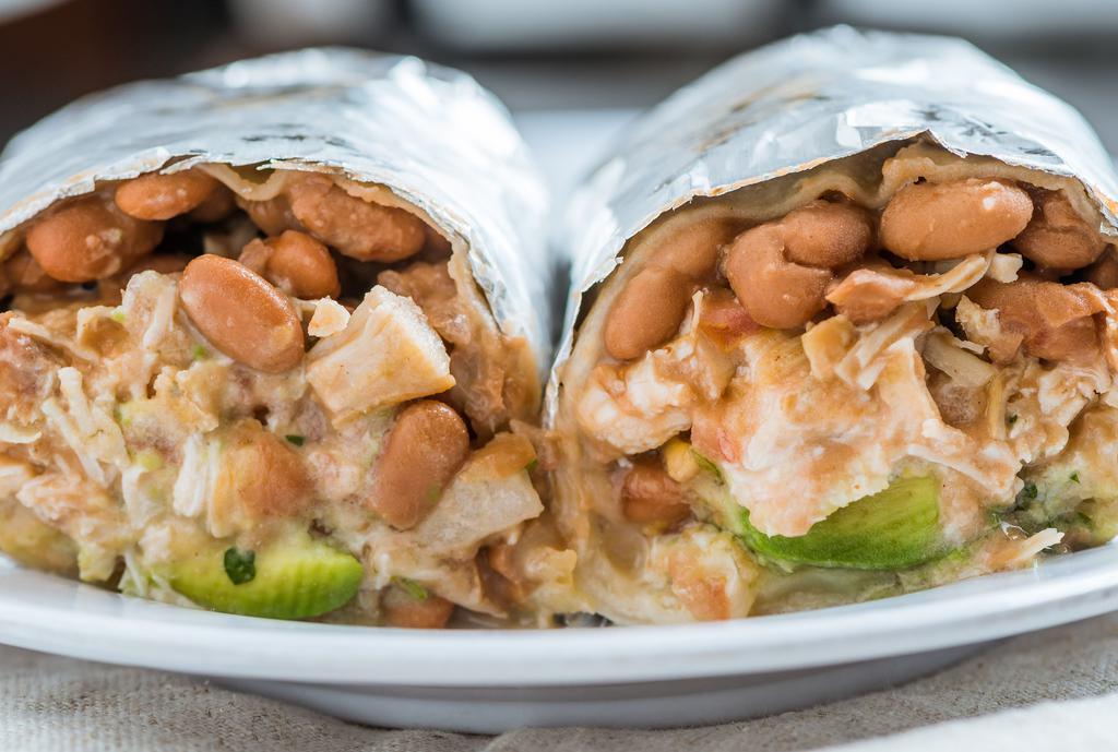 Super Burrito · Meat of your choice in a flour tortilla with whole beans, cheese, salsa fresca, avocado, cheese and sour cream.