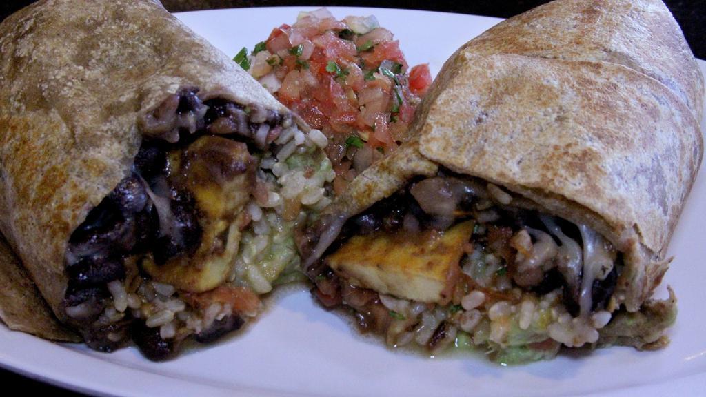 Super Plantain Burrito · Fried plantain with  melted cheese, brown rice, black beans, salsa, molcajete, avocado and sour cream with whole wheat tortilla then grilled.