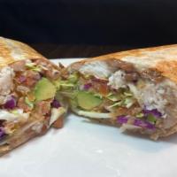 Super Fish Burrito · Grilled fish in a flour tortilla with melted cheese, cabbage, beans, salsa fresca & avocado.
