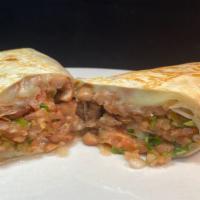 Regular Veggie Burrito · Whole pinto beans, in a flour tortilla with melted cheese and salsa fresca.