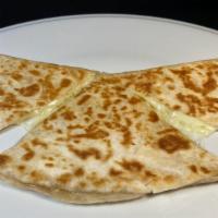 Regular Flour Quesadilla · Grilled flour  tortilla with melted cheese. Ask for guacamole, salsa & sour cream on the sid...