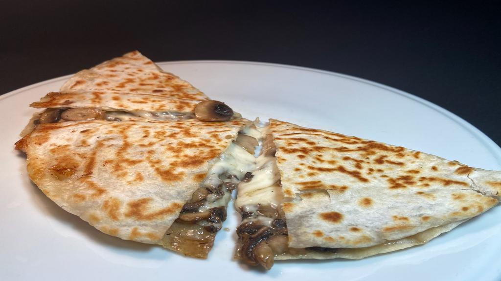 Mushroom Flour Quesadilla · Grilled flour tortilla  with melted cheese & sauteed mushrooms. Ask for guacamole, salsa & sour cream on the side for $2