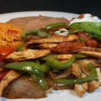 *Fajitas Plate · Meat of your choice with sauteed bell peppers, onions & tomatoes ,served with refried beans,...