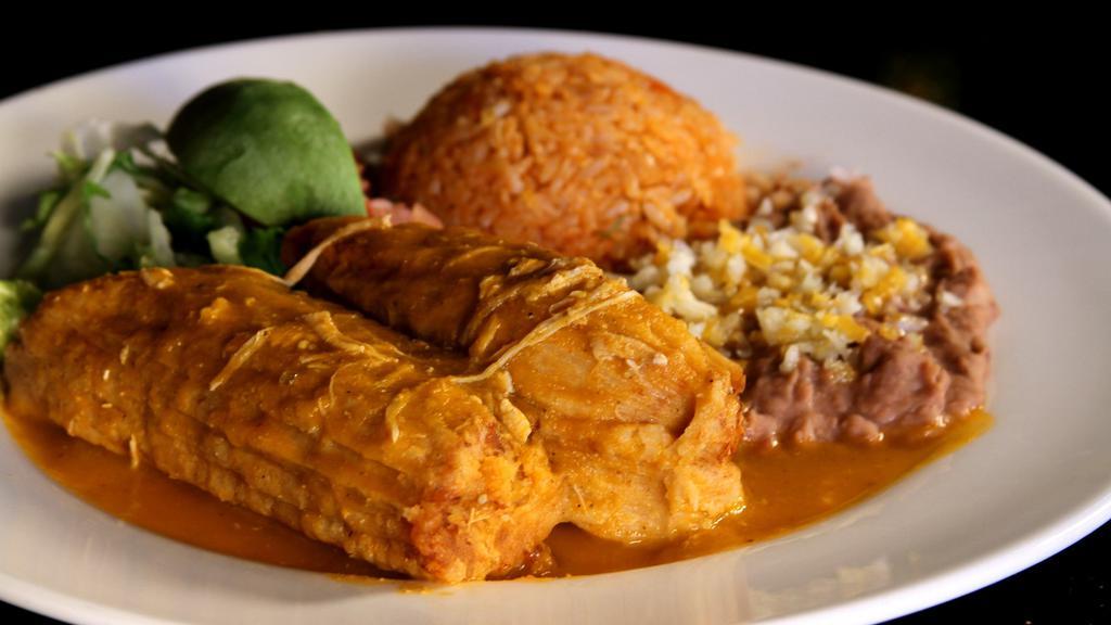 Tamales Plate (2) · Homemade corn dough tamales made with Chicken, pork or veggies served with Mexican rice, refried beans, avocado & small salad.