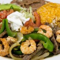 *Prawn & Steak Fajitas · Prawn and steak fajitas  with sauteed bell peppers, onions & tomatoes ,served with refried b...