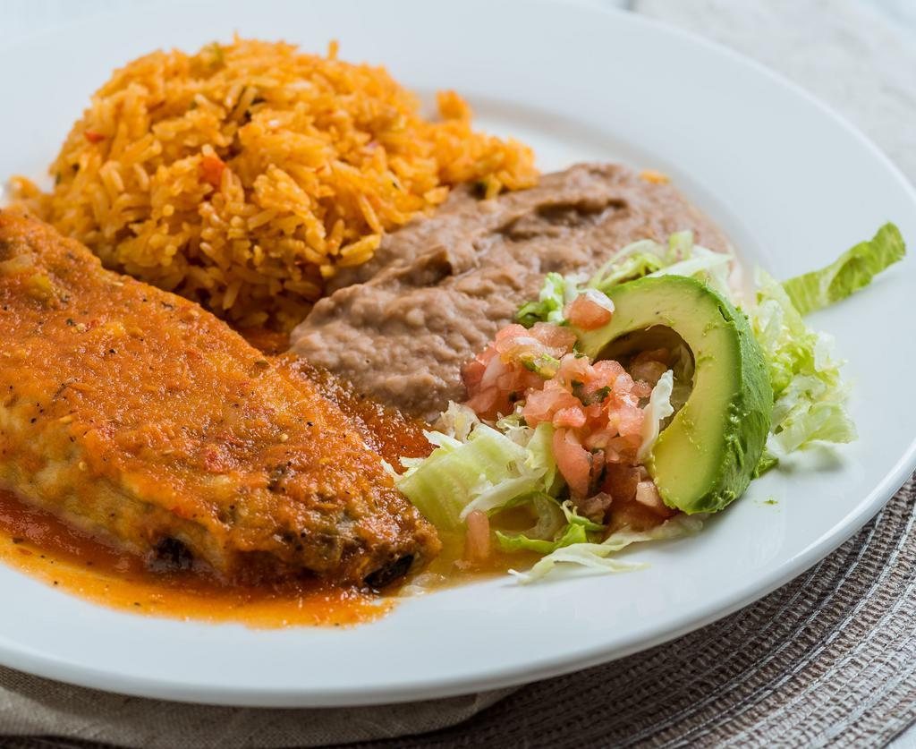 *Chile Relleno Plate · Fresh California pod  Filled with mexican cheese & salsa ranchera on top. Served with refried beans, Mexican rice, avocado & small salad. Your choice of corn or flour tortillas