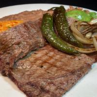 *Carne Asada Plate · Top sirloin Steak,served with grilled onions & jalapeño on top.  served with refried beans, ...