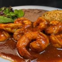 Camarones a la Diabla Plate · Large sauteed prawns in hot spicy sauce served with refried beans, Mexican rice, salad & avo...