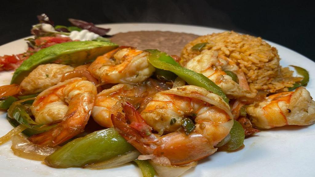 Prawn Fajitas · Grilled large prawns with sautéed onions, bell peppers and tomatoes.  served with refried  beans & Mexican rice.  Your choice of  4 corn or 3 flour tortillas.