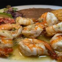 Camarones al Mojo de Ajo · Large sauteed prawns in fresh garlic sauce served with refried beans, Mexican rice, salad & ...