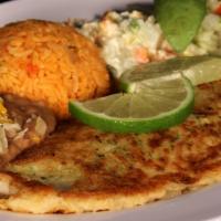 Pescado Empanizado · Breaded  filet of sole, sauteed in butter, served with refried  beans, Mexican rice &  potat...