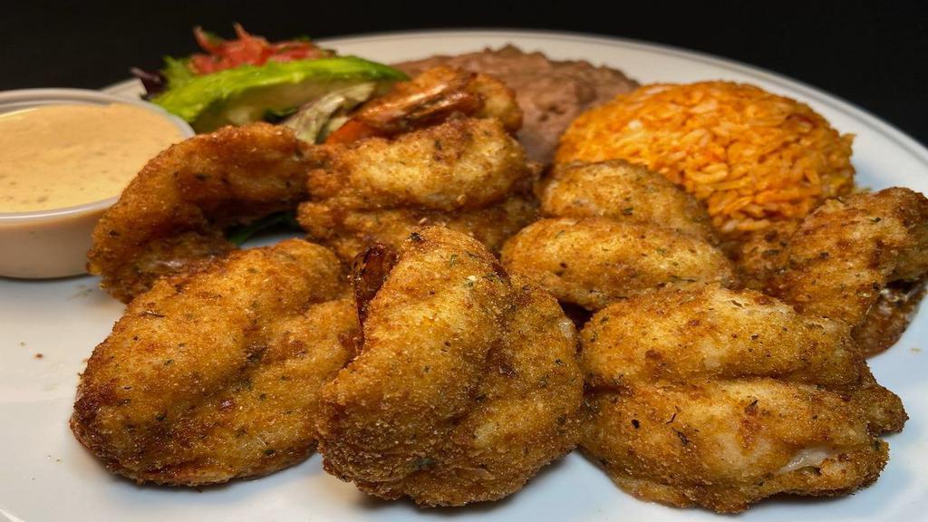 Camarones Empanizados · Eight breaded large  prawns served with refried beans, Mexican rice, salad & avocado slice. Your choice of  4 corn or 3 flour tortillas.   Served with four corn or three flour tortillas.