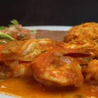 Camarones Rancheros · Large sauteed Prawns, onions, tomatoes, serranos with homemade ranchera sauce. Served with r...