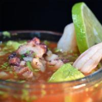 Campechana · Octopus and shrimp in a tomato broth.