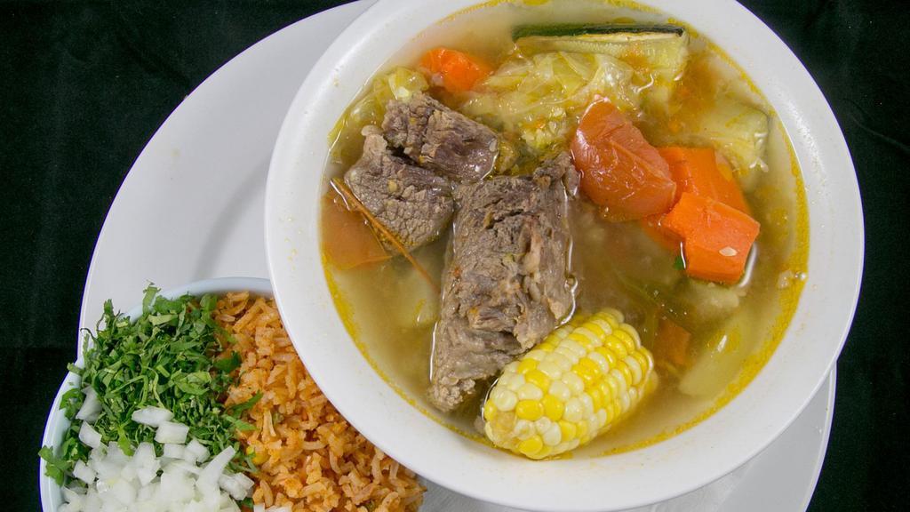 Caldo de Res · Beef stew, made daily. Comes with chayote, carrots, zucchini. Served with 4 corn or 3 flour tortillas. On the side rice, cilantro, onion & spices.