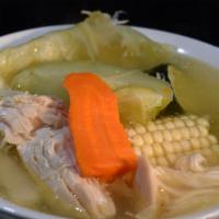 Caldo de Pollo · Chicken broth with chicken  made daily served with corn, carrots, chayote, corn & rice on th...