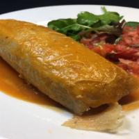 1 Tamale · Homemade corn dough tamale made with Chicken, pork or veggies served with a  small salad.