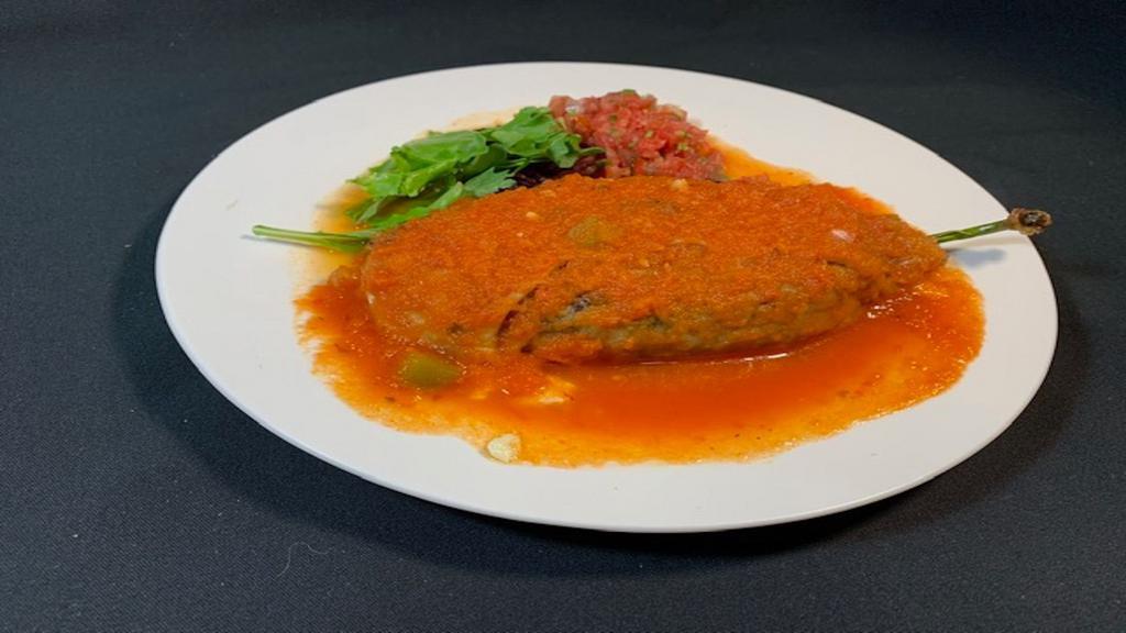 1 Chile Relleno · California fresh chilie pod filled with Mexican cheese, fried to perfection with Salsa ranchera on top, lettuce & salsa fresca.