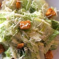 Insalata Cesare · Romaine lettuce with Ceasar Dressing, homemade croutons, and parmesan cheese.