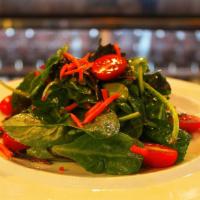 Verde Mista · Spring mixed green salad tossed in our house dressing with tomato, cucumber and carrot.
