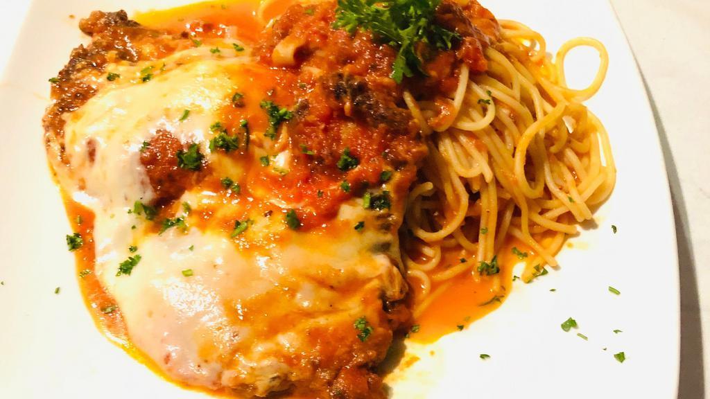 Veal Parmesan · Veal breaded and topped with marinara sauce and mozzarella cheese baked until bubbly. Served in a spaghetti marinara.
