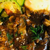 Veal Marsala · Veal scallopini with mushrooms in a marsala wine sauce.