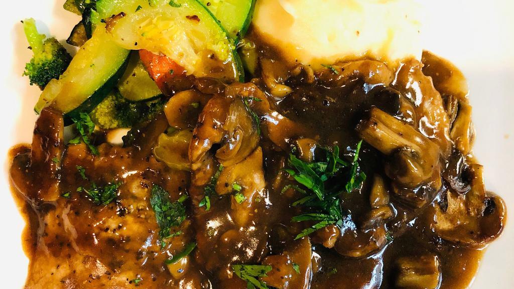 Veal Marsala · Veal scallopini with mushrooms in a marsala wine sauce.