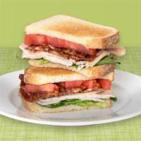 Turkey Club · Sliced turkey breast, cispy bacon, lettuce, tomato and mayo on your choice of bread.