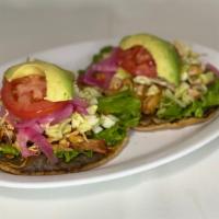 Panuchos Chicken · Handmade fried tortilla with black beans puree.
Lettuce, diced Cabbage, Chicken, Onions, Tom...