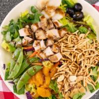 Eastern Chicken Salad · Marinated chicken breast, snow peas, water chestnuts, and crispy noodles over fresh greens a...