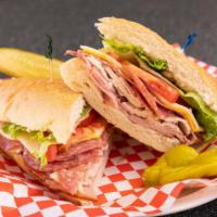 Poorboy · A combination of Italian dry salami, turkey, ham, American, and natural Swiss cheese topped ...